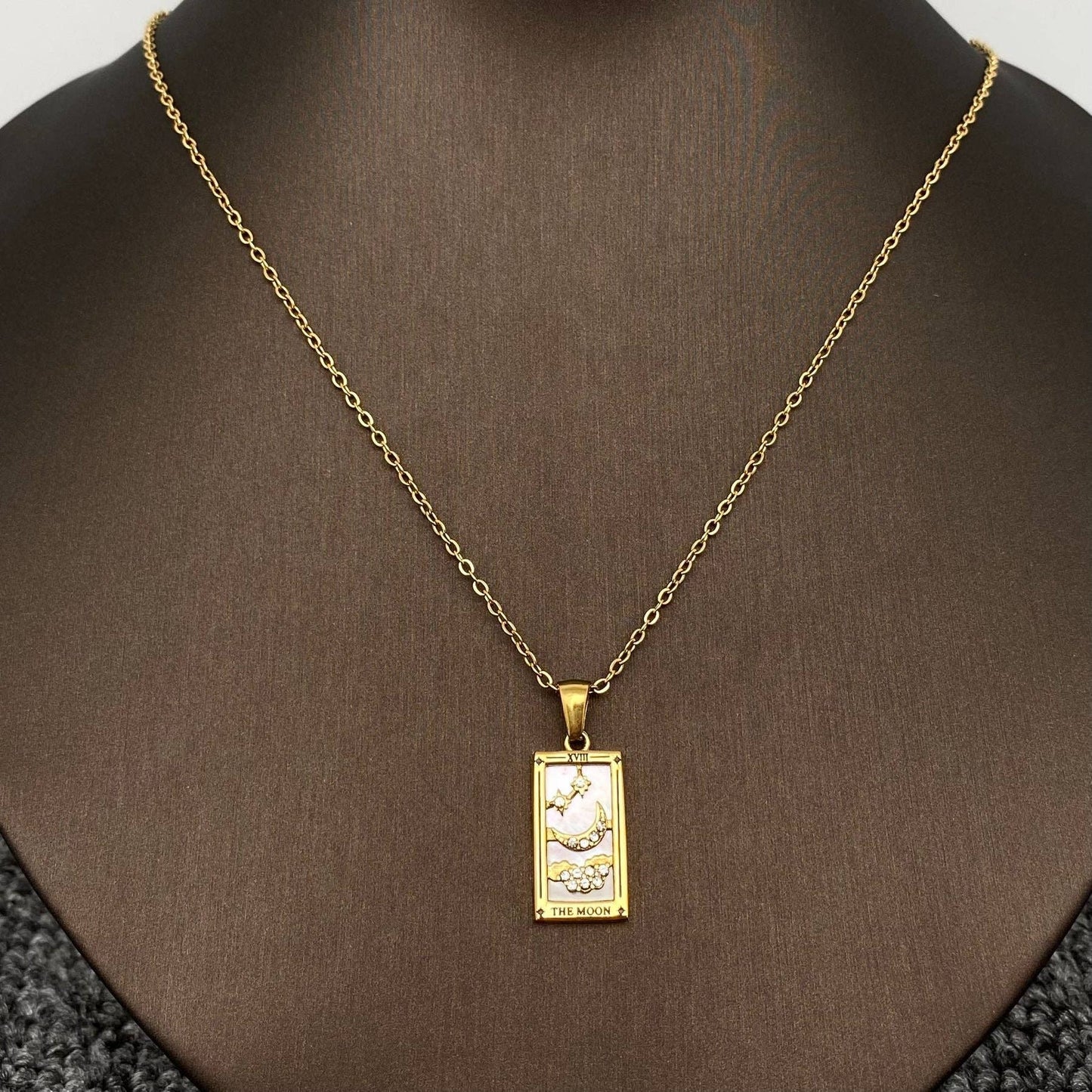 Gold plated pendant with Tarot Moon Card design on chain.